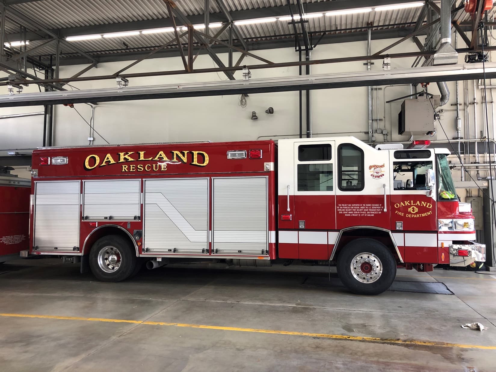 Oakland Fire Department rescue apparatus in profile.